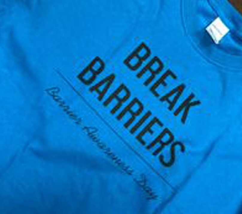 Picture of a t-shirt with "Break Barriers" written on it